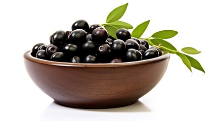 Black olives in wooden bowl with leaves isolated on white background cutout