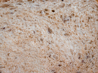 Crumb of the homemade white bread. Wheat bread slice texture background
