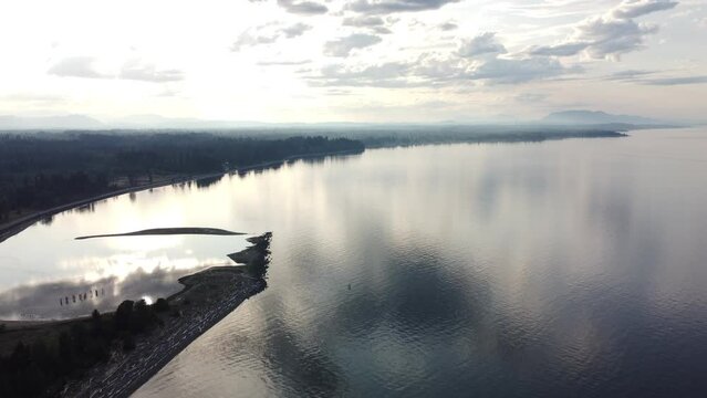 Vancouver Island High Aerial video overlooking calm sea near Comox British Columbia.
