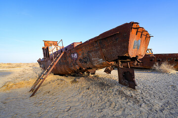 Rusty shipwreck lying on the seabed of the dried-up Aral Sea in Moynaq (or Muynak), a former...