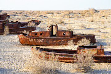 Rusty shipwreck lying on the seabed of the dried-up Aral Sea in Moynaq (or Muynak), a former...