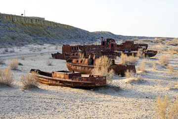 Rusty shipwreck lying on the seabed of the dried-up Aral Sea in Moynaq (or Muynak), a former...