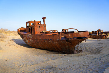 Rusty shipwreck lying on the seabed of the dried-up Aral Sea in Moynaq (or Muynak), a former...