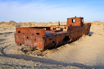 Rusty shipwreck lying on the seabed of the dried-up Aral Sea in Moynaq (or Muynak), a former...