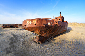 Rusty shipwreck lying on the seabed of the dried-up Aral Sea in Moynaq (or Muynak), a former...