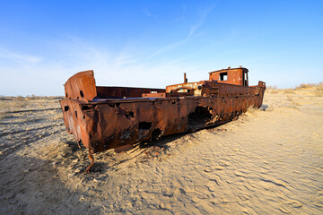 Rusty shipwreck lying on the seabed of the dried-up Aral Sea in Moynaq (or Muynak), a former...