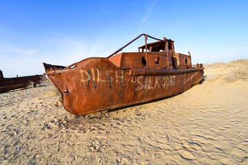 Rusty shipwreck lying on the seabed of the dried-up Aral Sea in Moynaq (or Muynak), a former...