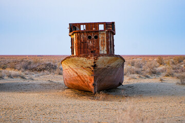 Rusty shipwreck lying on the seabed of the dried-up Aral Sea in Moynaq (or Muynak), a former...