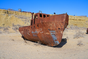 Rusty shipwreck lying on the seabed of the dried-up Aral Sea in Moynaq (or Muynak), a former...