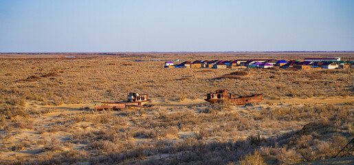 Rusty shipwreck lying on the seabed of the dried-up Aral Sea in Moynaq (or Muynak), a former...