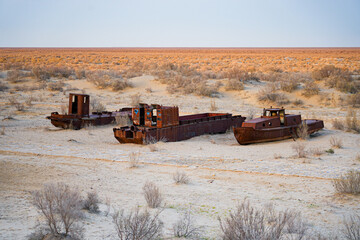 Rusty shipwreck lying on the seabed of the dried-up Aral Sea in Moynaq (or Muynak), a former...