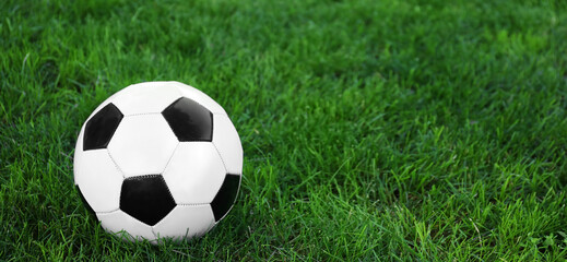 Soccer ball on green grass outdoors