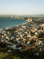 Vertical image of incredible view looking towards hotel zone from el mirador at Hill of the Cross Viewpoint in Puerto Vallarta, Mexico.