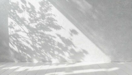 White wall as background. Abstract natural floral shadow patterns. White wooden floor.
