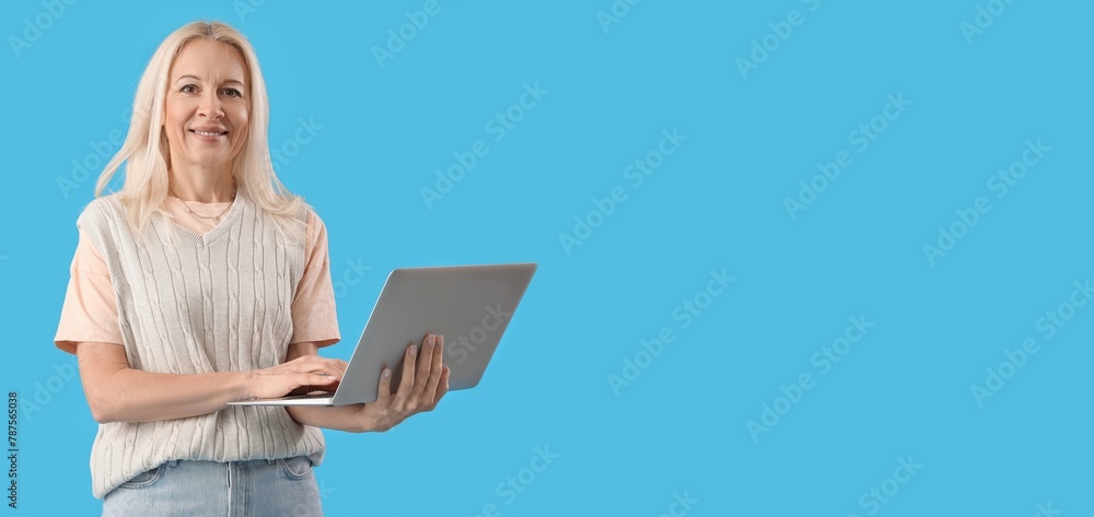 Aufkleber mature female programmer working with laptop on blue background with space for text