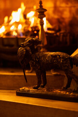 hunter dog statue beside fireplace