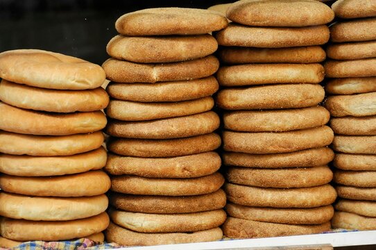 Fes, bazaar, pile of fresh Moroccan flatbread on a market display, Northern Morocco, Morocco, Africa