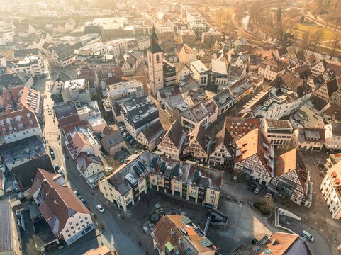Old town centre with church towers and narrow streets in the sunlight, sunrise, Nagold, Black Forest, Germany, Europe