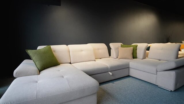 Exhibition of modern stylish upholstered furniture in the showroom of a furniture store