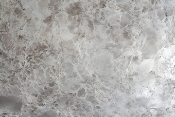 Obraz premium Detailed view of a white marble wall, showcasing its intricate patterns and textures.