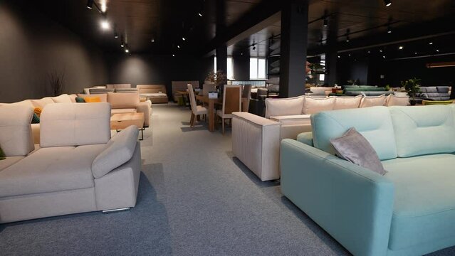 Couches and sofas displayed for sale in showroom at furniture store