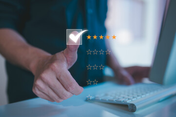 Customer service satisfaction survey concept.Business people or customers show satisfaction by pressing tick mark with five stars rating in satisfaction on virtual touch screen