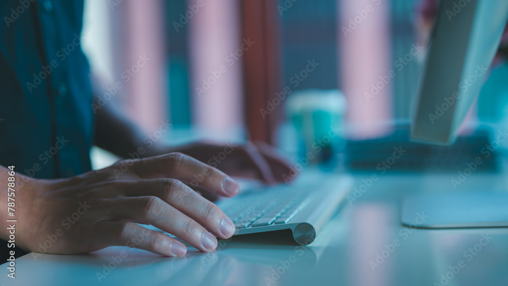 Poster close up hand typing on a laptop businessman working on computer keyboard