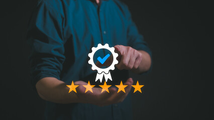 Quality management with Quality Assurance or QA and Quality Control or QC and improvement. Businessman hold virtual sign of quality Standardisation and certification with five stars