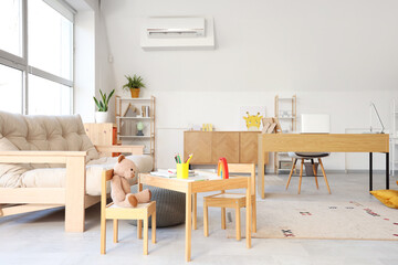 Interior of child psychologist's office with sofa and tables