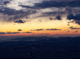 Fototapeta na wymiar Athens city view from above in dusk colors during a cold winter day after snow fall. Athens, Greece