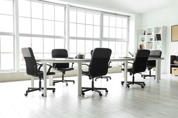 Interior of office with table prepared for meeting