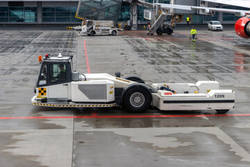 The towbarless tractor (TBL) on a runway of an international airport
