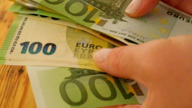 Womens hands count euro bills.Expenditures and earnings of women in Europe.Money accumulations and savings. 4k footage