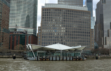 brookfield place ferry terminal on the hudson river in downtown manhattan with nyc skyline...