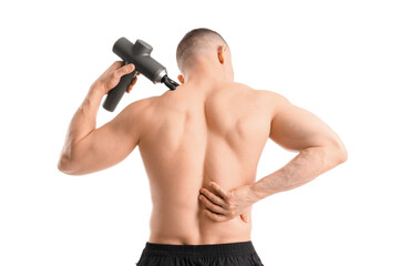 Muscular young man with percussive massager on white background, back view