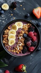 Healthy smoothie bowl topped with fresh fruits and granola. Vibrant acai bowl, richly garnished.