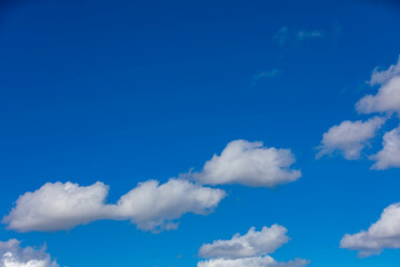 White clouds under blue sky background