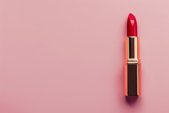 red lipstick on pink background with copy space	