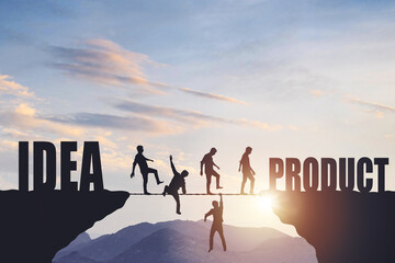 Silhouettes of people walking on a rope between rocks, success concept