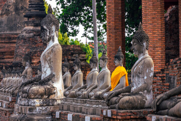 The background of important religious attractions, Wat Yai Chai Mongkhon, has an old Buddha statue and a large pagoda for tourists to study the history of Ayutthaya in Thailand.