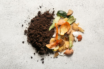 Organic waste and soil on white grunge background. Compost recycling concept