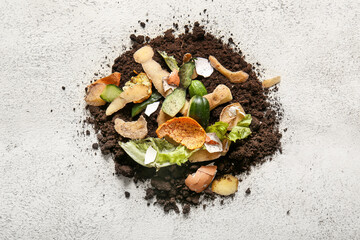 Organic waste and soil on white grunge background. Compost recycling concept
