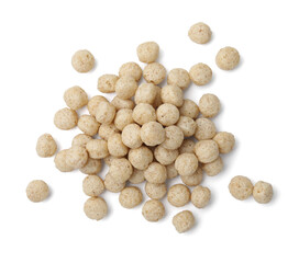 Fototapeta na wymiar Tasty cereal balls isolated on white, top view