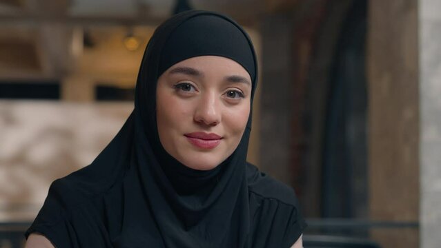 Muslim islamic Arabian woman in black hijab happy ethnic beautiful girl arabic turkish businesswoman employer manager student lady smiling Islam religion faith female beauty business portrait indoors