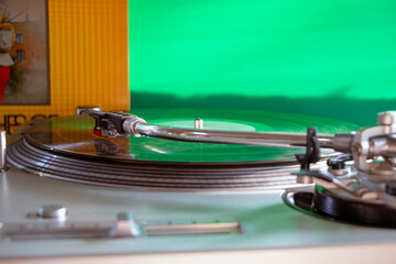 Captured in action, the needlehead traces the grooves of the vinyl, symbolizing the DJ's mastery of...