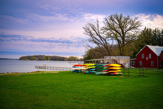 Boathouse and stacked kayaks over the green park at the Lake Monona in Madison, Wisconsin, USA