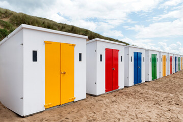 Beach huts with colourful doors