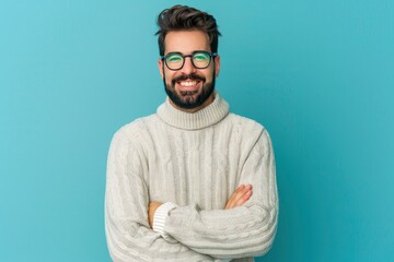 Young handsome man with beard wearing casual sweater and glasses over blue background happy face smiling with crossed arms looking at the camera. Positive person - generative ai