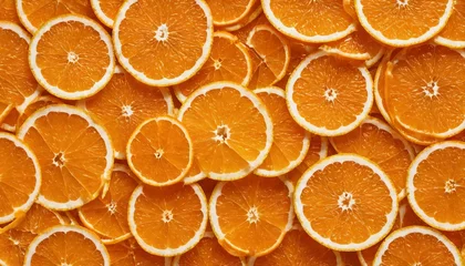  Bright orange wedges arranged backdrop - colorful citrus fruit display © ibreakstock