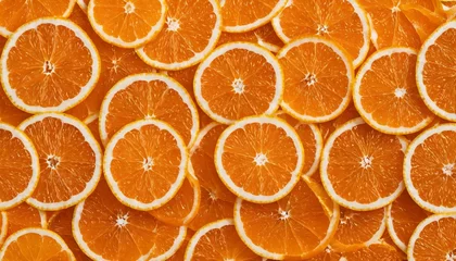  Vibrant orange slices fruit background - citrus pieces pattern © ibreakstock